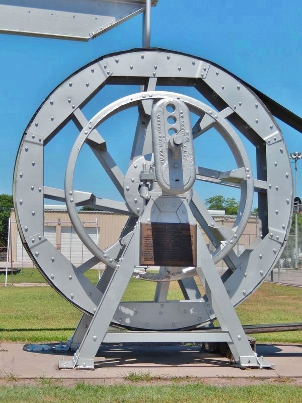 J.S. Abercrombie Mineral Company Marker (<i>tall view; marker is mounted on bandwheel support</i>) image. Click for full size.