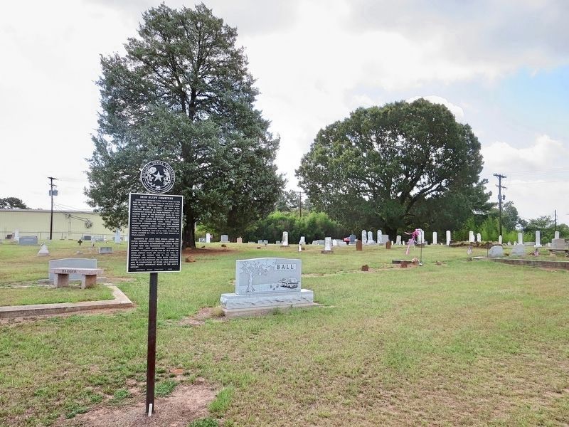 View of marker and graves in background. image. Click for full size.
