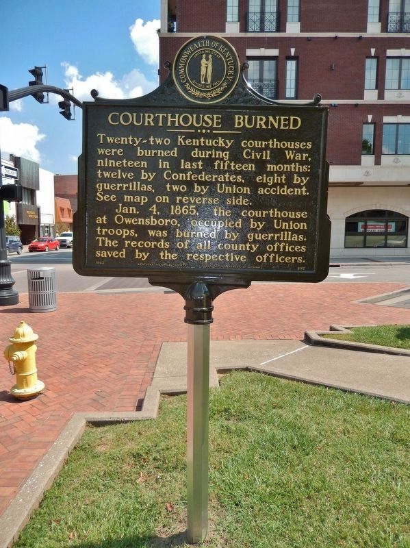 Courthouse Burned Marker (<i>side 1; tall view; looking east along West 2nd Street</i>) image. Click for full size.
