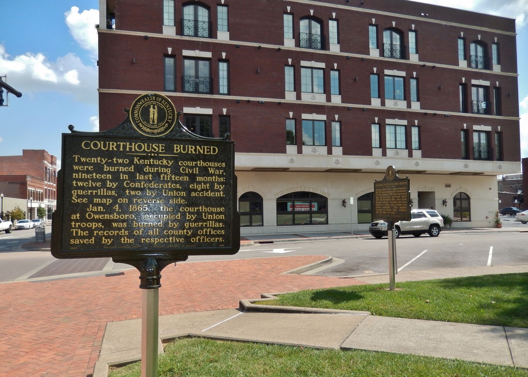 Courthouse Burned Marker (<i>side 1; wide view; related marker visible at right</i>) image. Click for full size.