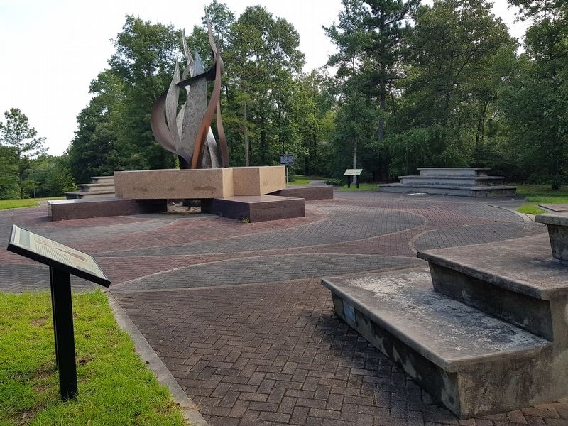 Cultural Exchange and Cooperation Marker with the Sacred Fire sculpture in the background. Click for full size. Cultural Exchange and Cooperation Marker with the Sacred Fire sculpture in the background image. Click for full size.