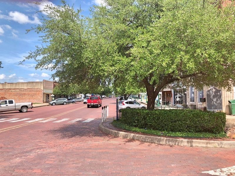 Incorporation of Commerce Marker on right of photo under tree. Main Street is on the left. image. Click for full size.