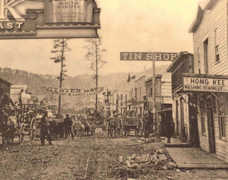 Marker detail: 1876 Deadwood photo shows some of the Chinese businesses on Main Street image. Click for full size.