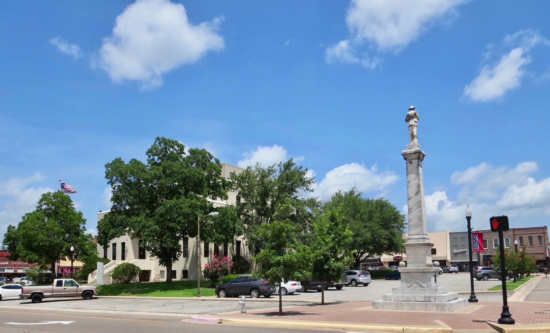 Titus County Confederate Monument with the courthouse in the background. image. Click for full size.