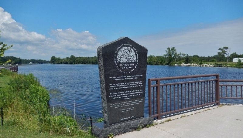 Peshtigo Fire Marker (<i>wide view; looking north across Peshtigo River</i>). Click for full size. Peshtigo Fire Marker (<i>wide view; looking north across Peshtigo River</i>) image. Click for full size.