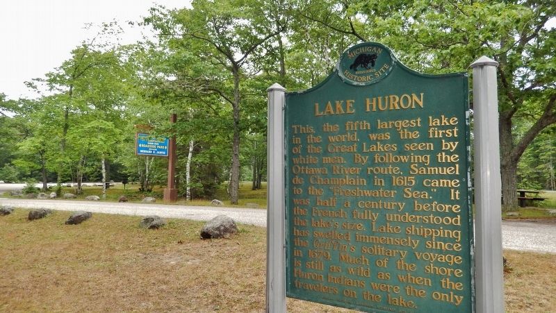 Lake Huron Marker (<i>back side; wide view; roadside parking and US Highway 23 in background</i>) image. Click for full size.