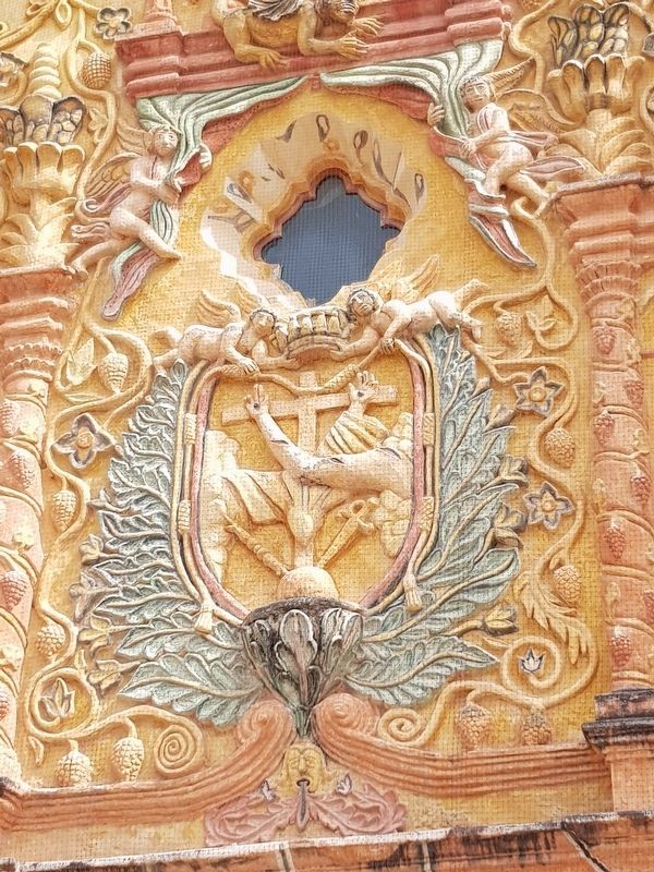 The Franciscan shield on the Mission at Concá. Click for full size. The Franciscan shield on the Mission at Concá image. Click for full size.