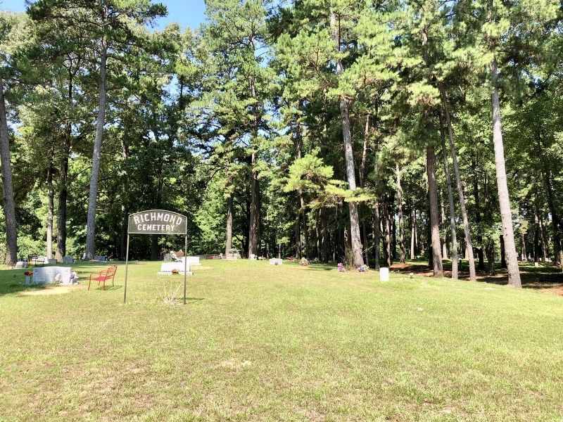 Entrance to the Richmond Cemetery - marker is deep into the woods on extreme right. image. Click for full size.
