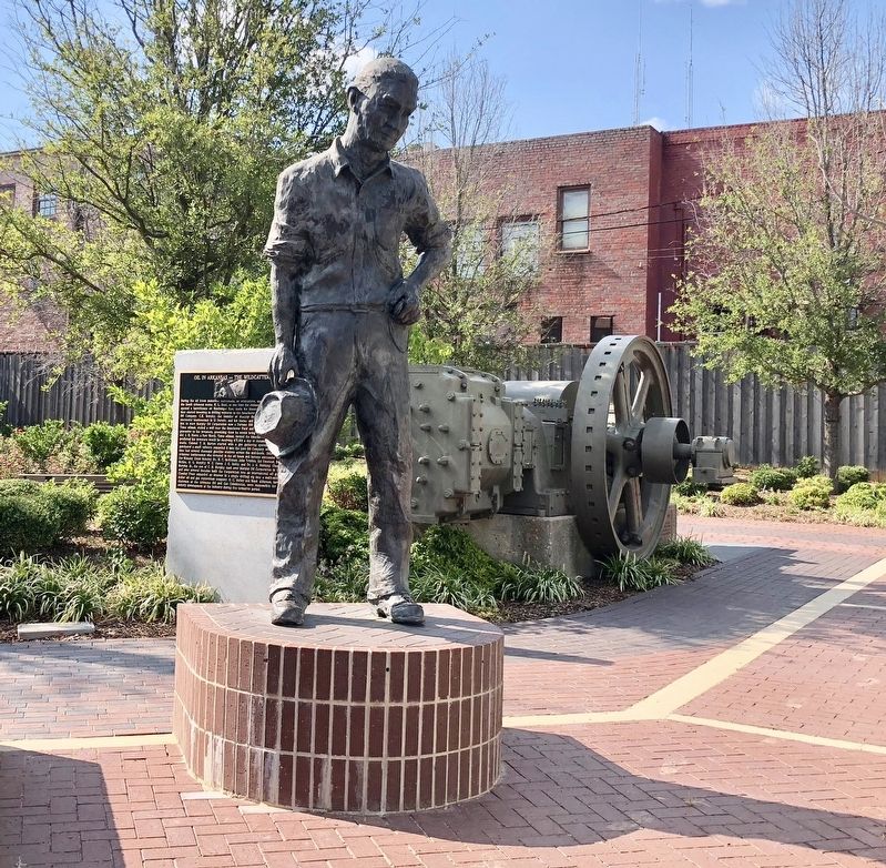 The Wildcatters Marker is seen behind statue of Edwin Boyd Alderson, Sr. image. Click for full size.