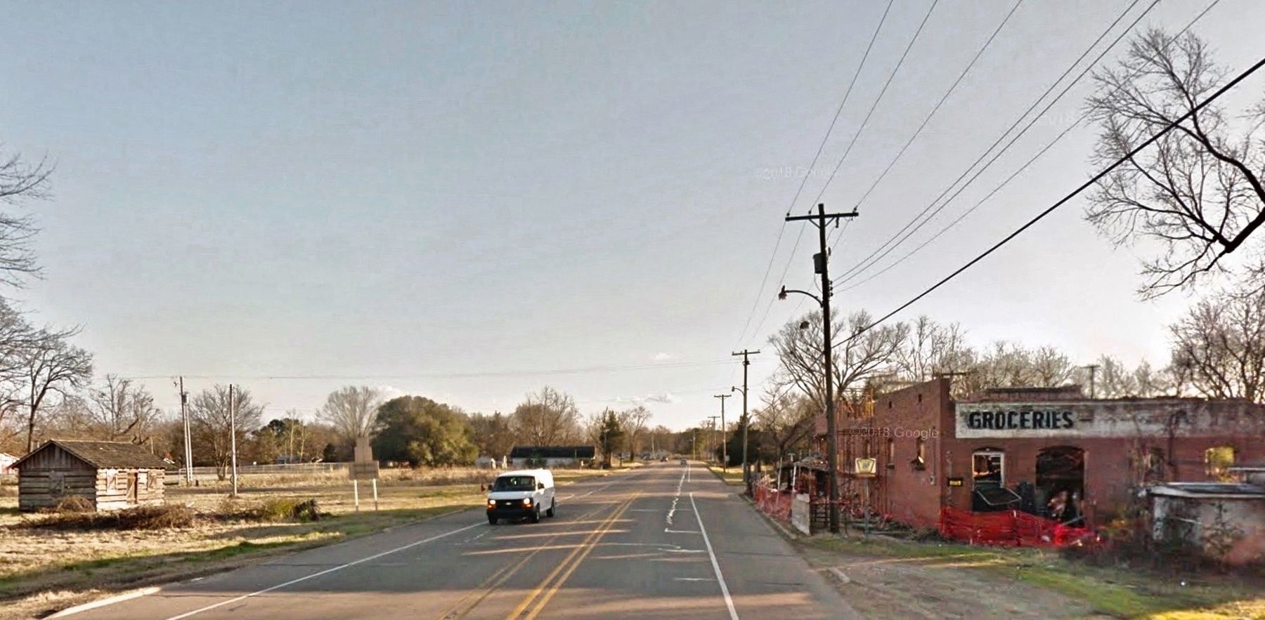 Cabin on left, red brick store on right.. Click for full size. Cabin on left, red brick store on right. image. Click for full size.