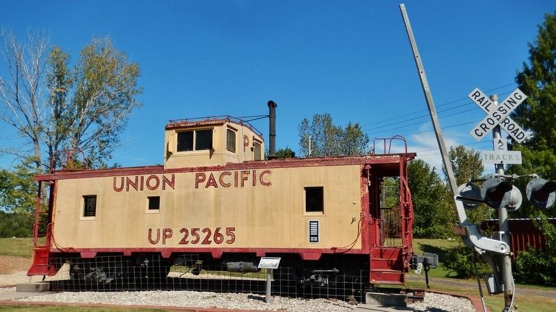 The Iron Horse Arrives Marker (<i>wide view; marker at center; Union Pacific caboose background</i>) image. Click for full size.