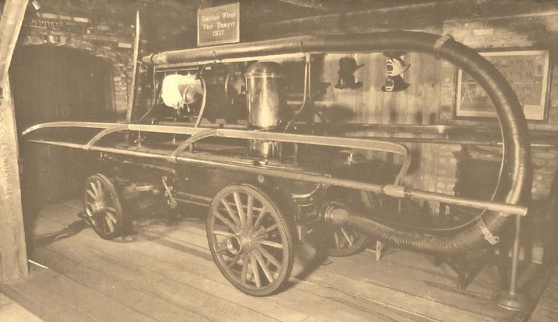 Marker detail: Toledo's first fire engine, 1837, hand pulled and hand pumped image. Click for full size.