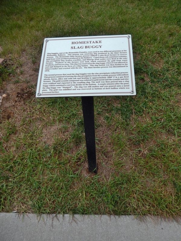 Homestake Slag Buggy Marker (<i>tall view; marker located beside sidewalk</i>) image. Click for full size.