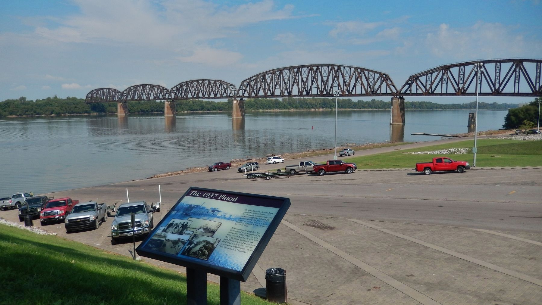 The 1937 Flood Marker (<i>wide view; boat ramp, Ohio River, and railroad bridge in background</i>). Click for full size. The 1937 Flood Marker (<i>wide view; boat ramp, Ohio River, and railroad bridge in background</i>) image. Click for full size.