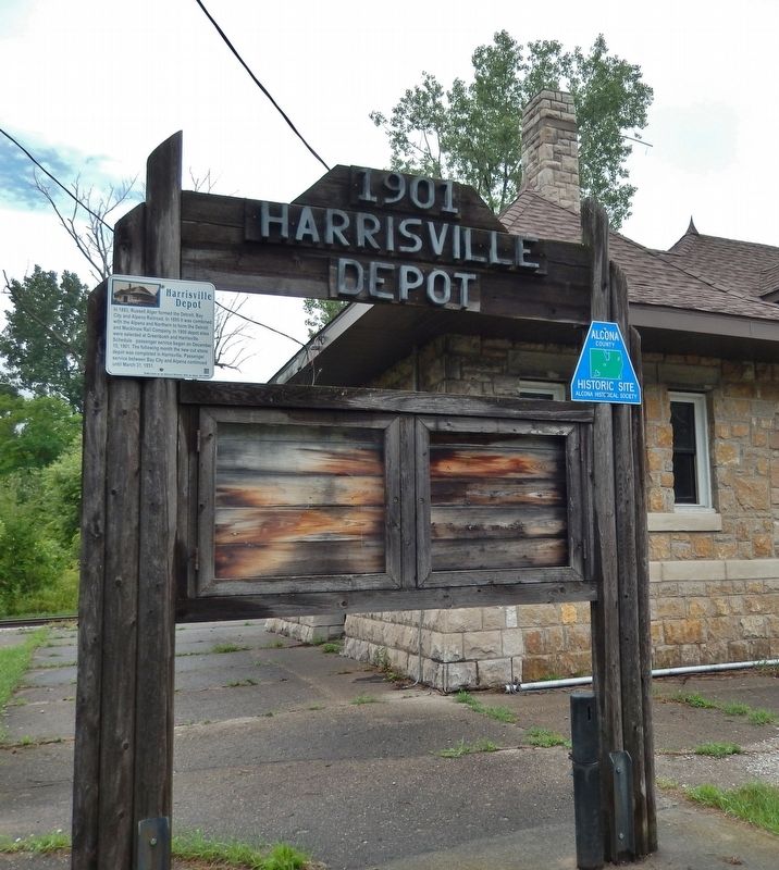 Harrisville Depot Marker (<i>tall view; marker mounted on left side of railroad depot sign</i>) image, Touch for more information