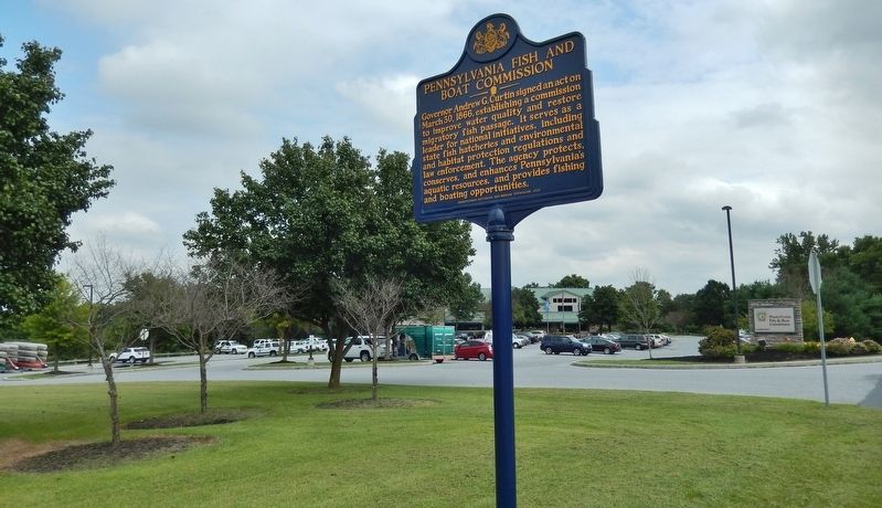Pennsylvania Fish & Boat Commission Marker (<i>wide view; administration building in background</i>). Click for full size. Pennsylvania Fish & Boat Commission Marker (<i>wide view; administration building in background</i>) image. Click for full size.