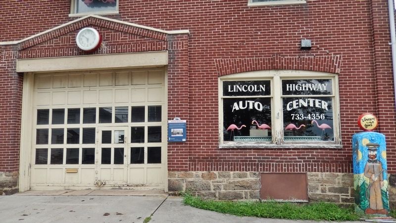 Lincoln Highway Heritage Corridor Marker (<i>wide view; marker is just right of garage door</i>). Click for full size. Lincoln Highway Heritage Corridor Marker (<i>wide view; marker is just right of garage door</i>) image. Click for full size.