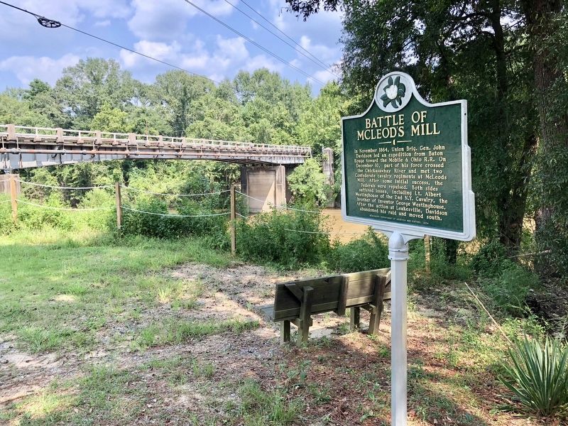 Marker with the Chickasawhay River and old River Street bridge in background. image. Click for full size.