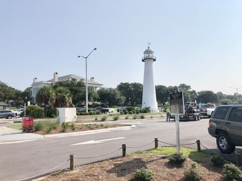 View of marker, Biloxi Lighthouse and the Biloxi Visitors Center. image. Click for full size.