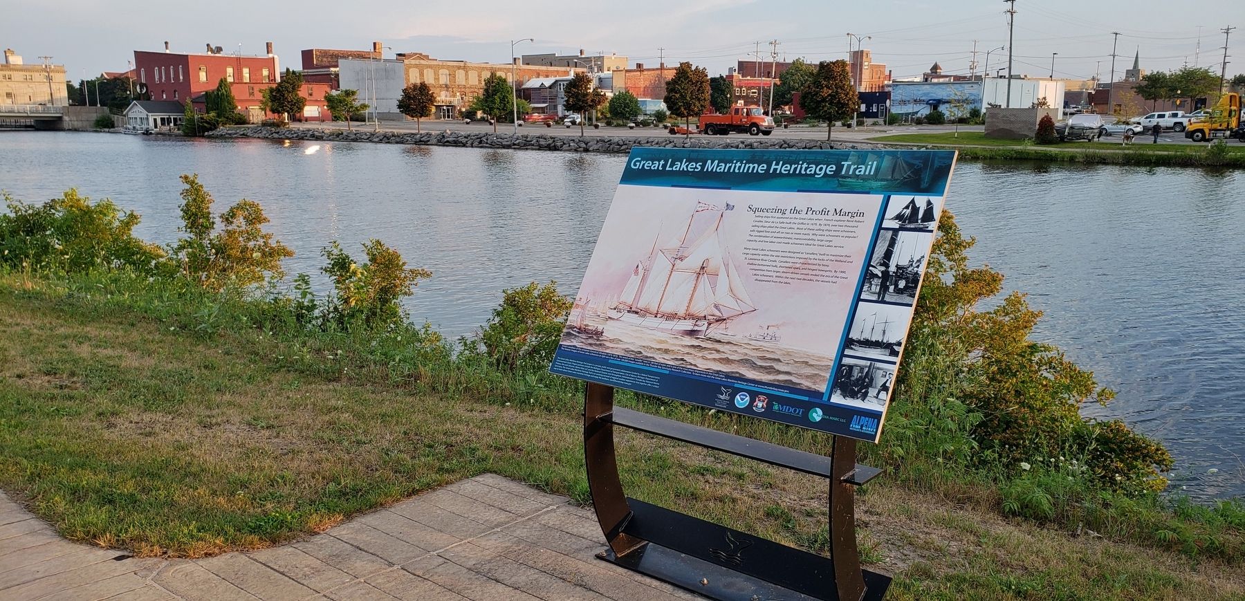 Squeezing The Profit Margin Marker (<i>wide view; Thunder Bay River in background</i>) image. Click for full size.