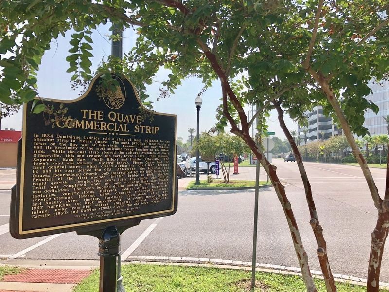 View of Five Trails Marker in distance through trees across the street. image. Click for full size.