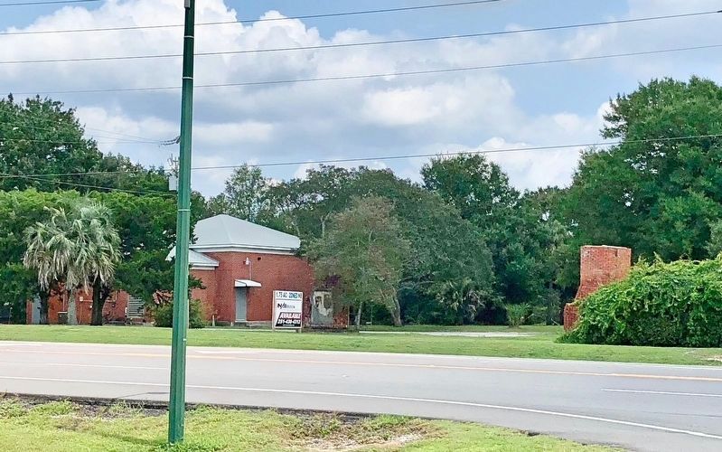 View across road to remnants of brick tower mentioned on marker. image. Click for full size.
