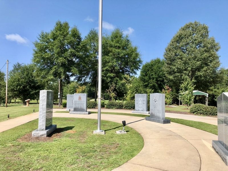 First Creek War Marker is on second from right of flagpole. image. Click for full size.