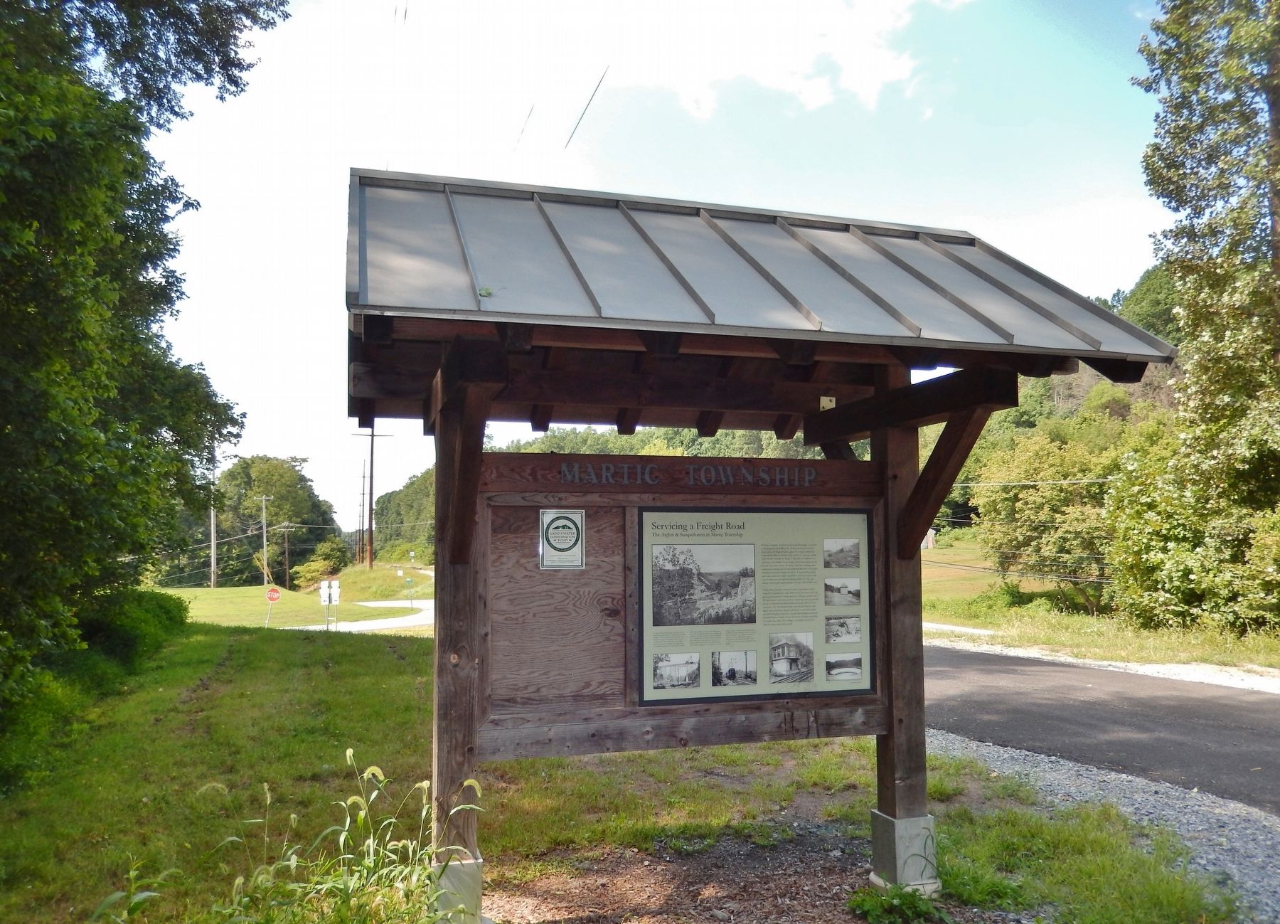 Servicing a Freight Road Marker & Kiosk (<i>wide view looking west; Marticville Road behind</i>). Click for full size. Servicing a Freight Road Marker & Kiosk (<i>wide view looking west; Marticville Road behind</i>) image. Click for full size.