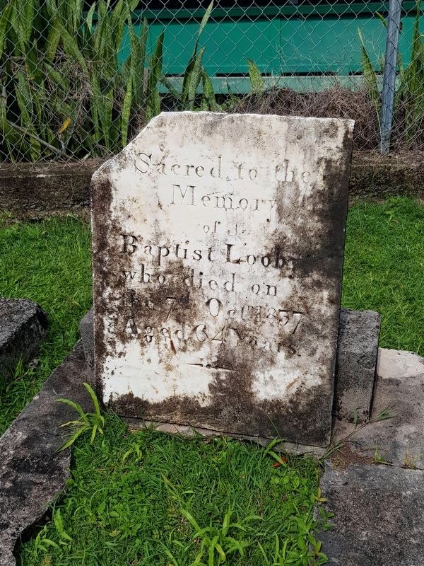 A gravestone in the church's small cemetery image. Click for full size.