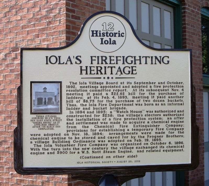 Iola’s Firefighting Heritage Marker. Click for full size. Iola’s Firefighting Heritage Marker image. Click for full size.