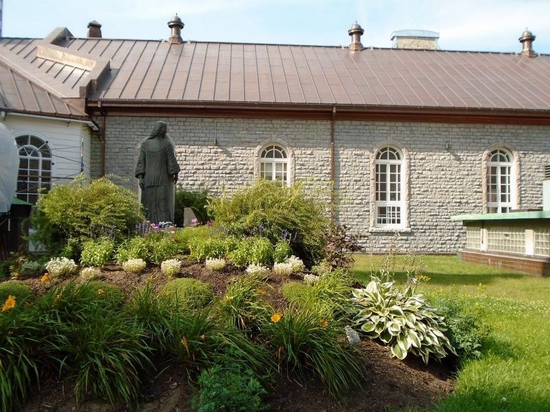 Marie-Catherine de Saint-Augustin Statue in Monastery Garden. Click for full size. Marie-Catherine de Saint-Augustin Statue in Monastery Garden image. Click for full size.