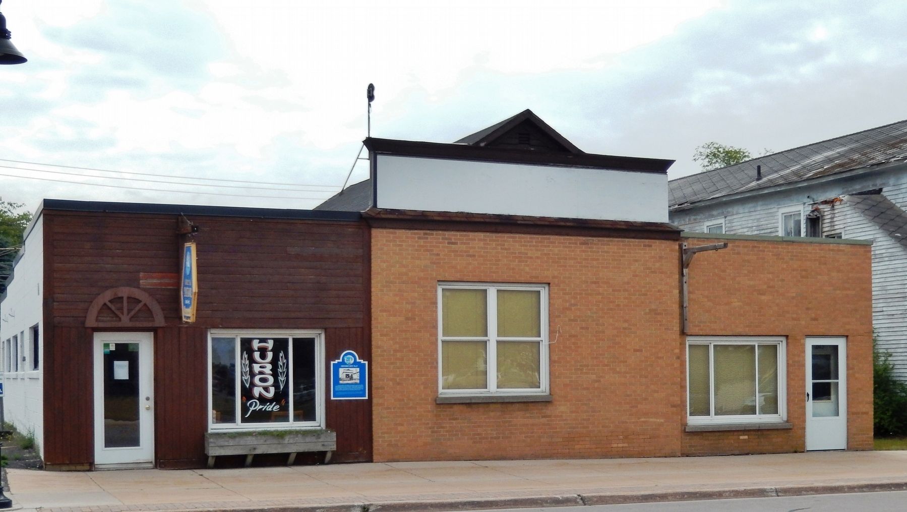 Presque Isle County Bank Building (<i>wide view; attached, adjacent buildings on both sides</i>) image. Click for full size.