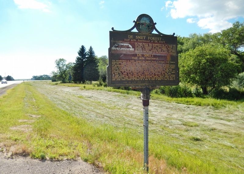 De Smet Forest / De Smet Marker (<i>wide view; looking west along US Highway 14 toward De Smet</i>). Click for full size. De Smet Forest / De Smet Marker (<i>wide view; looking west along US Highway 14 toward De Smet</i>) image. Click for full size.