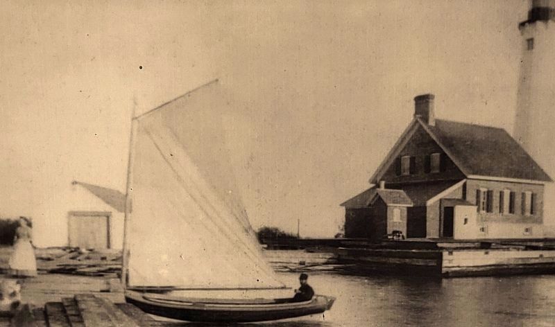 Marker detail: This 1880s photo shows water surrounding the wooden "crib" protecting the lighthouse image. Click for full size.