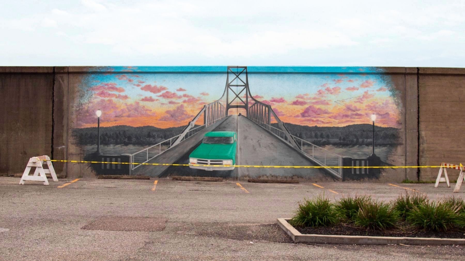 Flood wall mural at the foot of 6th street, the former approach to the Silver Bridge image. Click for full size.
