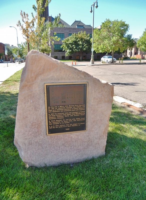 Dakota Iron Store Marker (<i>tall view; Old Minnehaha County Courthouse in background</i>) image. Click for full size.