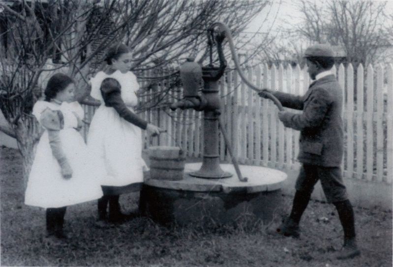 Children pump water at Hampton Institute Virginia. Click for full size. Children pump water at Hampton Institute Virginia image. Click for full size.