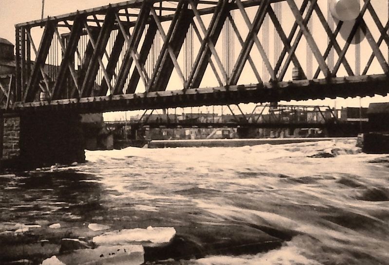 Marker detail: CMS&P railroad bridge with Cascade dam in background. Click for full size. Marker detail: CMS&P railroad bridge with Cascade dam in background image. Click for full size.