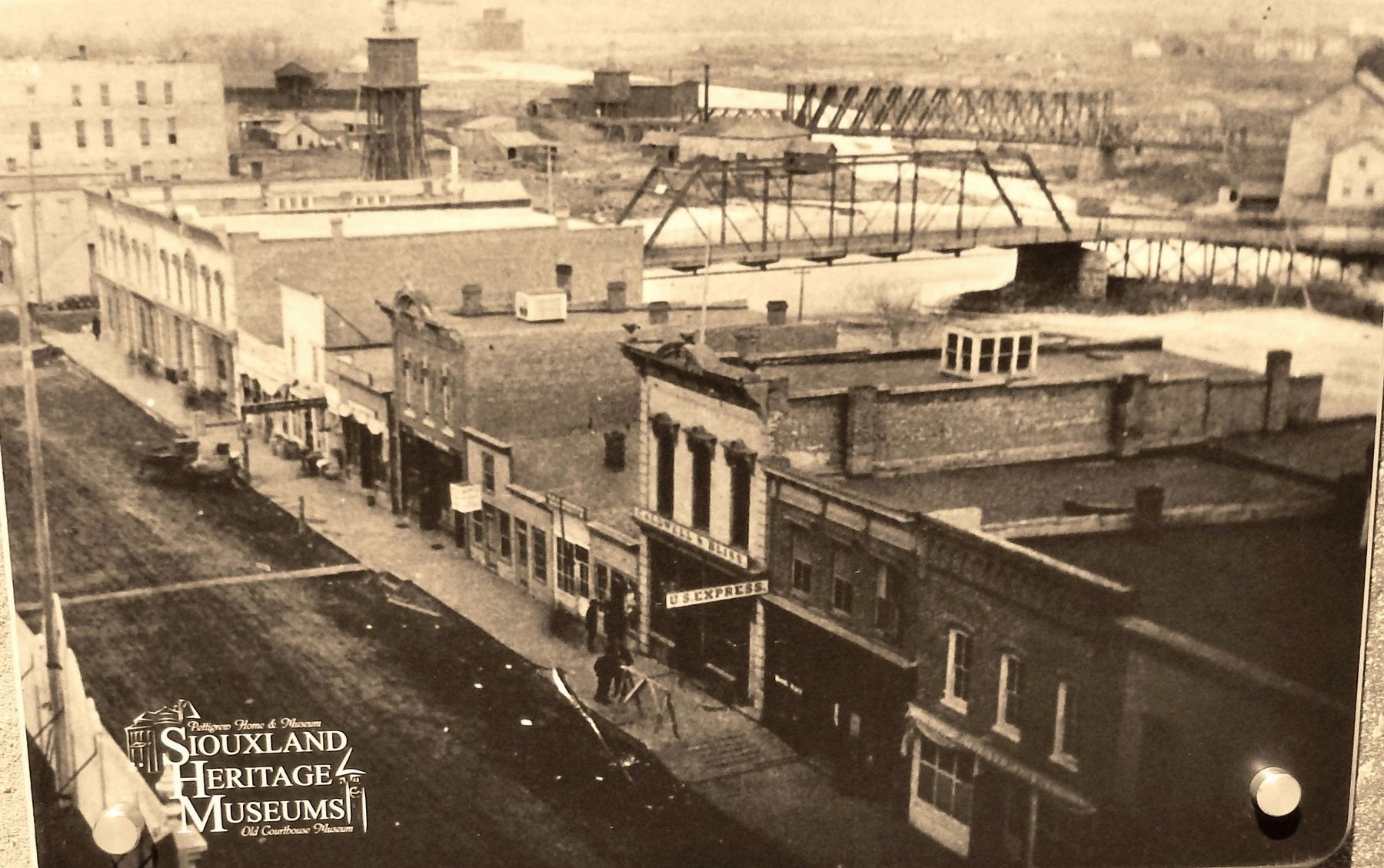 Marker detail: View of Phillips Avenue at Eighth Street bridge over the Big Sioux River, ca. 1880s image. Click for full size.