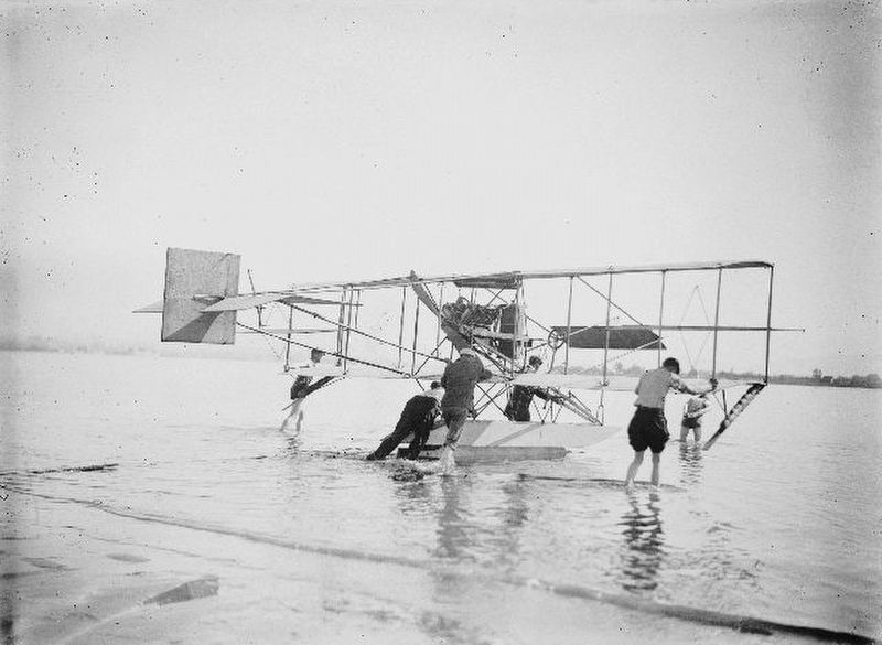 <i>Men pushing Glenn Curtiss' seaplane into the water at North Island</i> image. Click for full size.