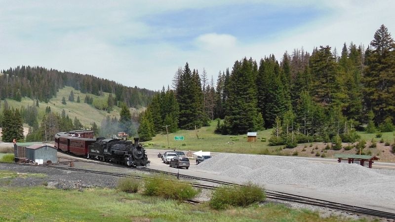 Cumbres Pass Marker (<i>wide view of marker at north end of parking lot as train arrives</i>) image. Click for full size.