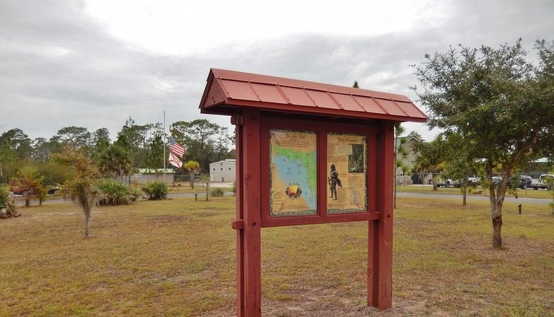 Badly Wounded Marker Kisok (<i>wide view: Goethe State Forest Headquarters in background</i>) image. Click for full size.