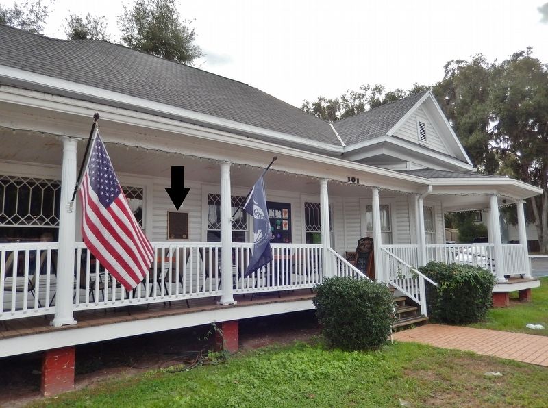 The George Carter House Marker (<i>wide view; marker mounted on wall between flags</i>) image. Click for full size.