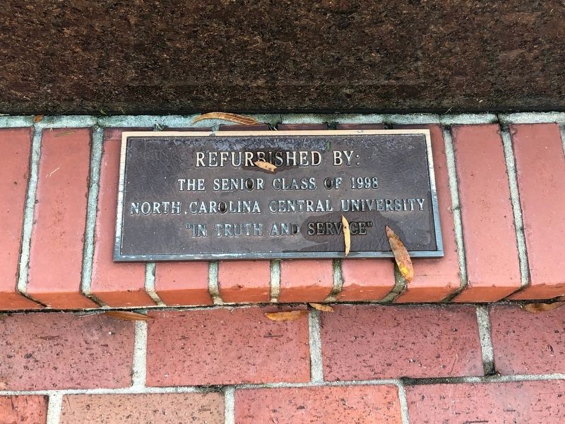 Plaque at base of statue image. Click for full size.