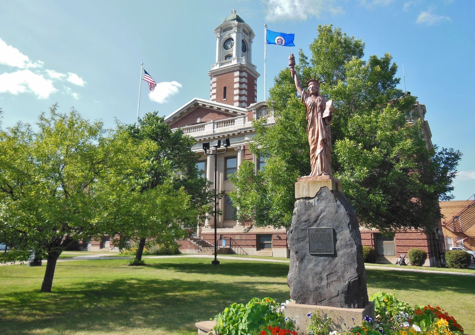 Donald Kozlik Memorial - Statue of Liberty Replica (<i>Hibbing, MN City Hall in background</i>). Click for full size. Donald Kozlik Memorial - Statue of Liberty Replica (<i>Hibbing, MN City Hall in background</i>) image. Click for full size.