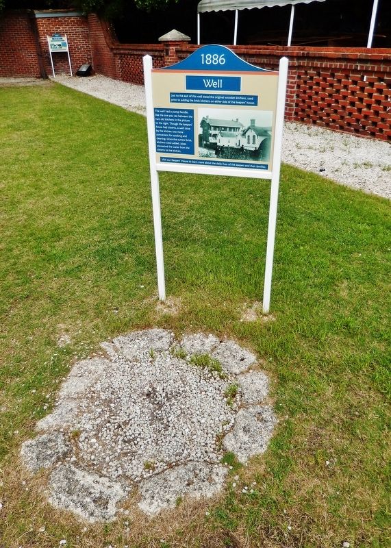1886 Well Marker (<i>tall view; capped well remains in foreground</i>) image. Click for full size.