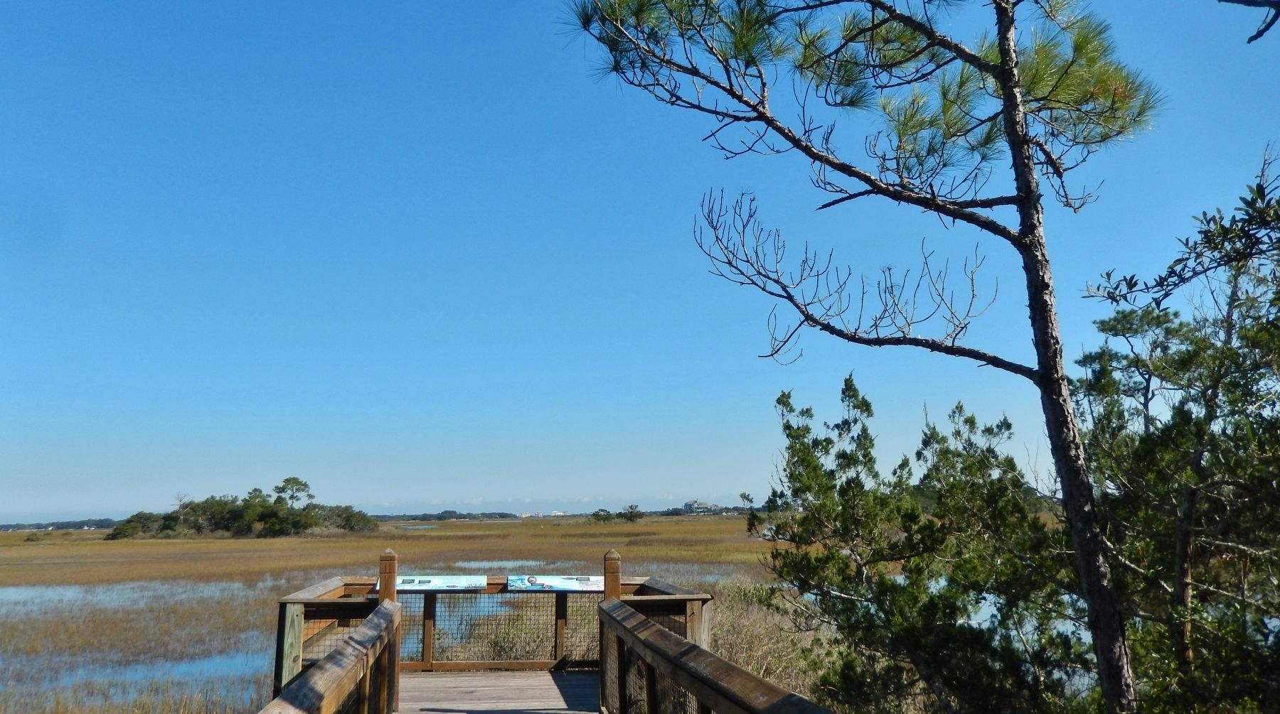 Fort Mose Site (<i>boardwalk and marker visible in foreground</i>). Click for full size. Fort Mose Site (<i>boardwalk and marker visible in foreground</i>) image. Click for full size.