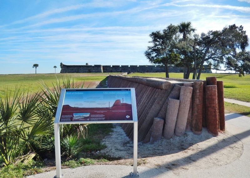 Wall of Defense Marker (<i>wide view; wall & Castillo de San Marcos in background</i>) image. Click for full size.