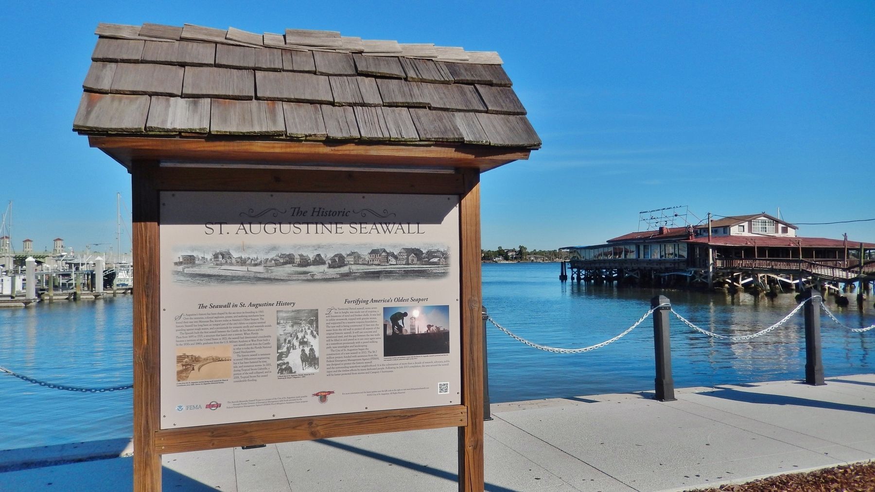 The Historic St. Augustine Seawall Marker (<i>wide view; seawall & Matanzas River in background</i>) image. Click for full size.