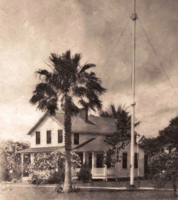 Marker detail: Original frame lodge and flagpole, 1933 image. Click for full size.